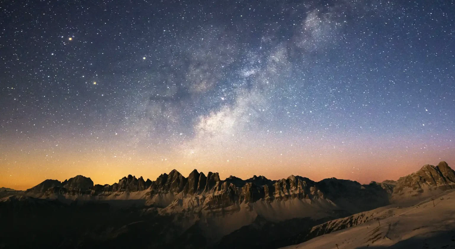 signs from the universe stars and nebula shown above a mountain range