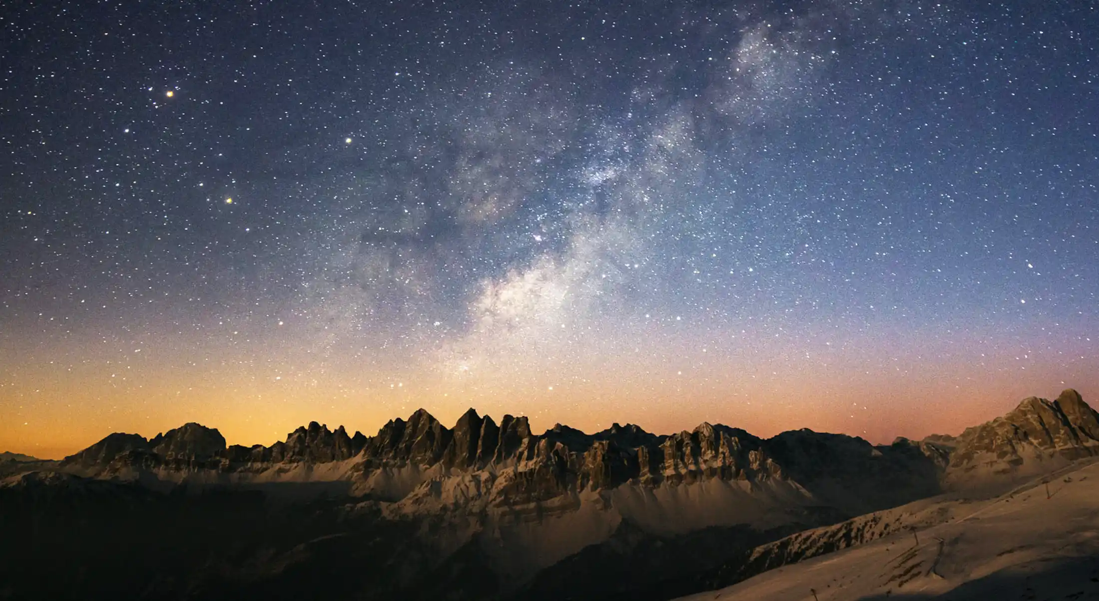 signs from the universe stars and nebula shown above a mountain range